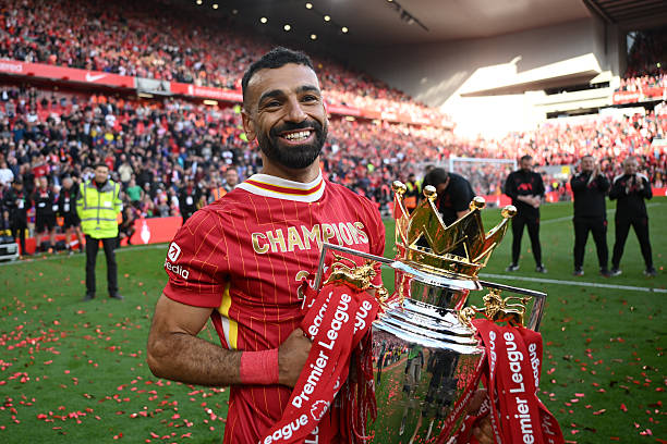 LIVERPOOL, ENGLAND - MAY 25: Mohamed Salah of Liverpool  celebrates with the Premier League trophy trophy, as Liverpool are crowned the Champions of the Premier League for the 2024/25 Season, following the Premier League match between Liverpool FC and Crystal Palace FC at Anfield on May 25, 2025 in Liverpool, England. (Photo by Michael Regan/Getty Images/Getty Images For The Premier League)